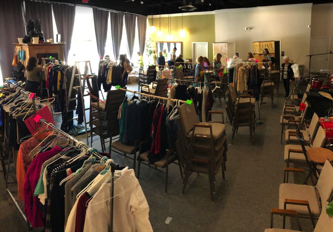 A community clothes exchange laid out in the church room