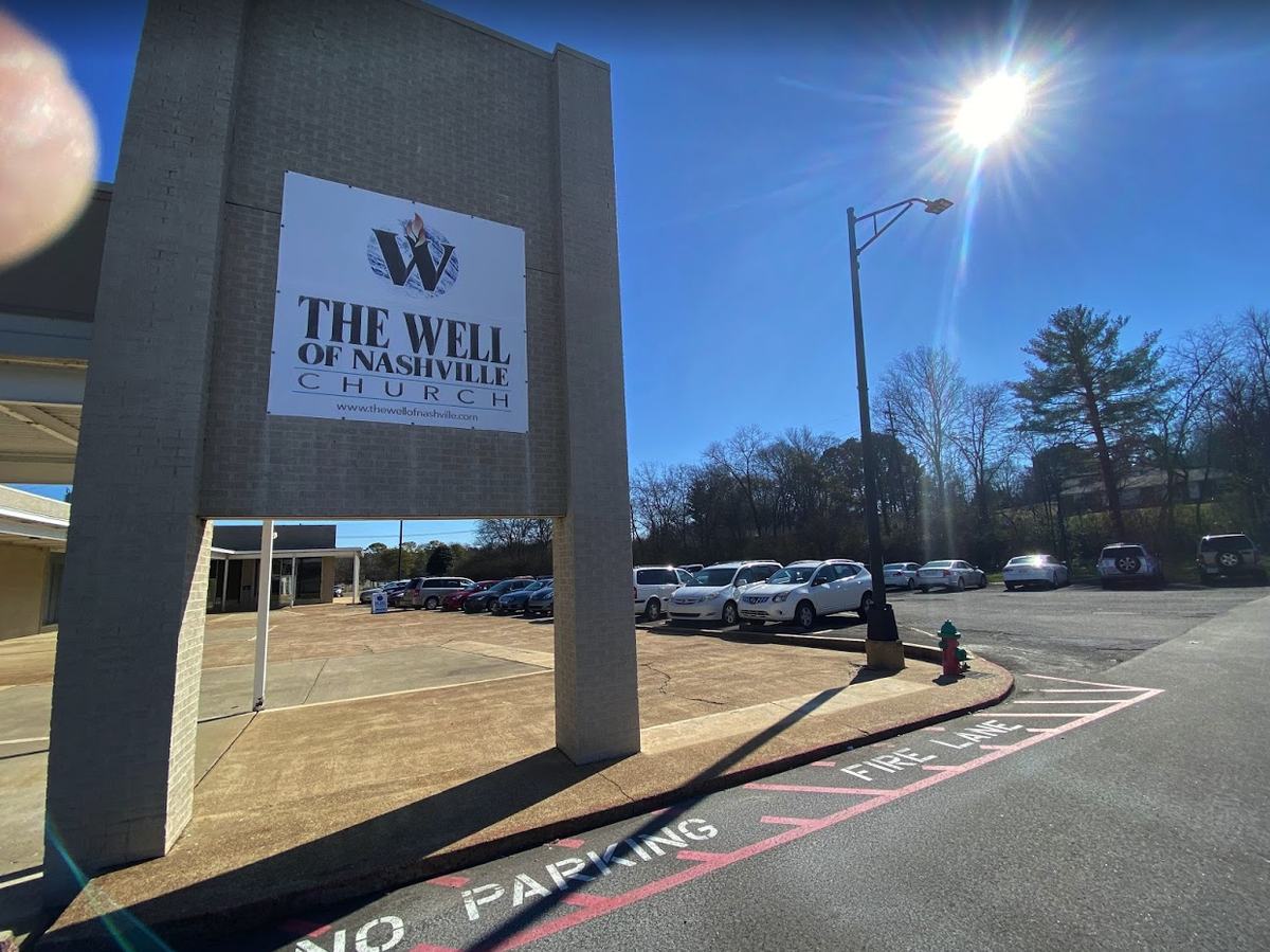 The Well of Nashville Church exterior signage at dusk